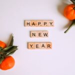 Letter Tiles beside Mandarins